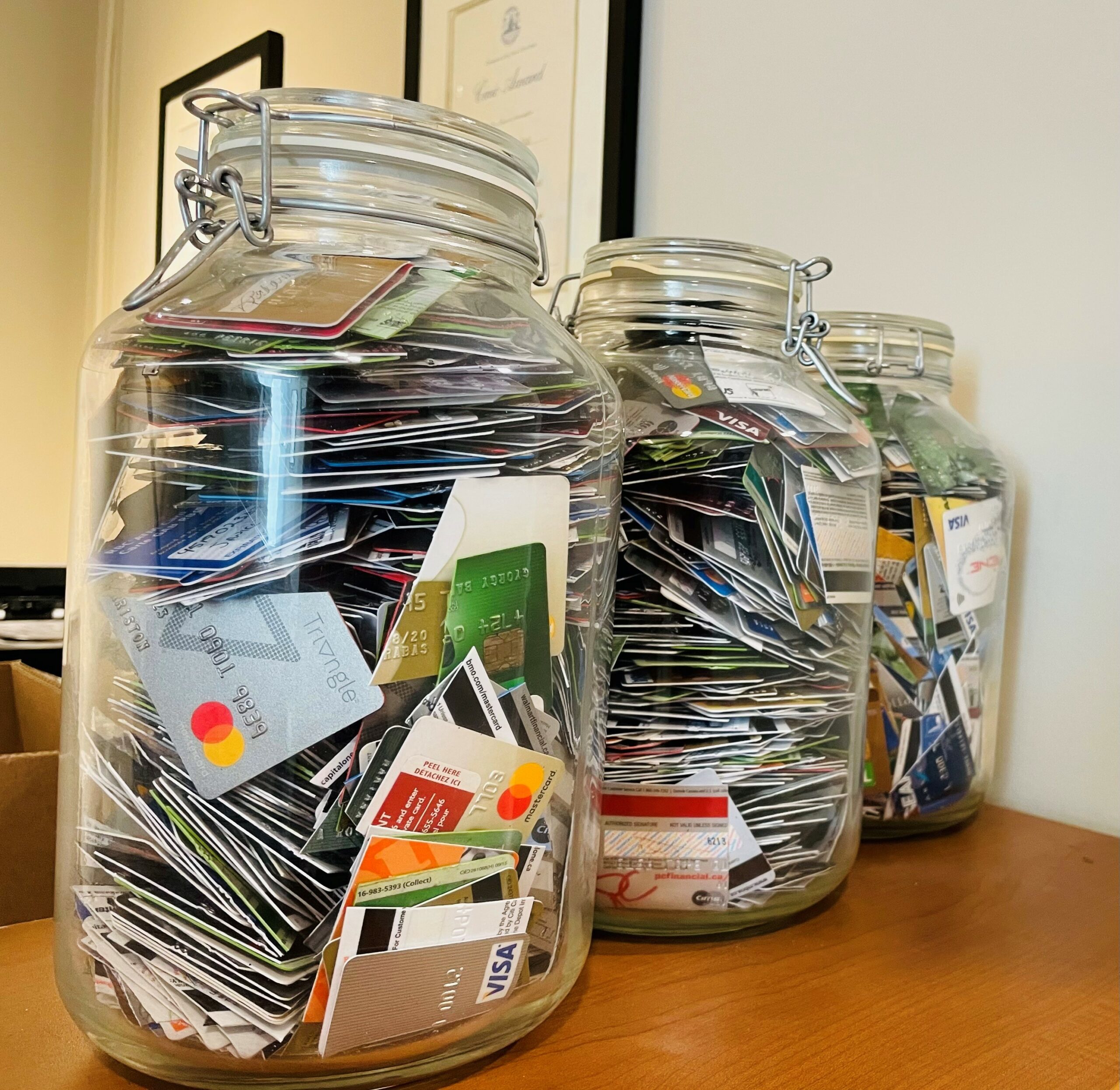 Jars filled with cut up credit cards