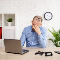 Person struggling with computer work